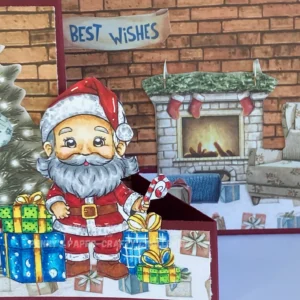 Close up picture of Santa is here with on the left the cosy home scene Close-up of the cosy living room scene and the coloured digital stamp Santa is here included in the Double Z fold card tutorial. The right panel features a fireplace, an armchair, and the "Best Wishes" sentiment, all brought to life with warm, festive colours.