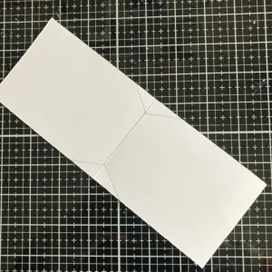 Card base of the shaped tea bag card A detailed view of the tea bag-shaped card base, highlighting its crisp edges and tea bag-inspired design, ready to be layered with decorative elements.
