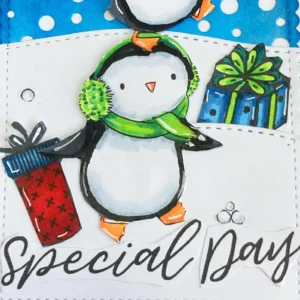 Close up of the sentiment on the bottom. Close-up of the bottom section of a Penguin Birthday Card showing the rest of the sentiment 'Special Day,' along with red star embellishments and layered snowdrifts for dimension.
