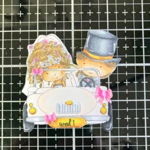 Coloured digital stamp Wedding card. Close-up of the coloured and cut-out digital wedding car stamp from Polkadoodles. The detailed colouring of the car gives the card a joyful and elegant feel, perfect for a handmade wedding card design