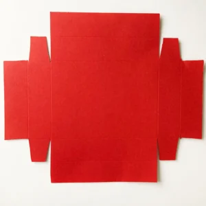 Cut base inside box of the slider treat box The cut red cardstock base, forming the inner box of the valentine treat box.