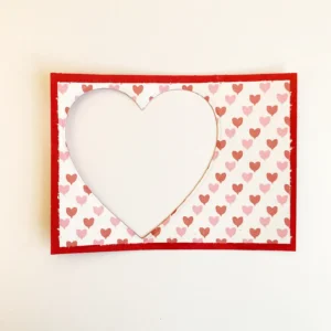 Die-cut heart window The heart-shaped window die-cut through multiple layers of paper for the valentine treat box.
