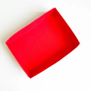 Inside box of the slider treat box The folded red box that fits snugly into the sleeve of the valentine treat box.