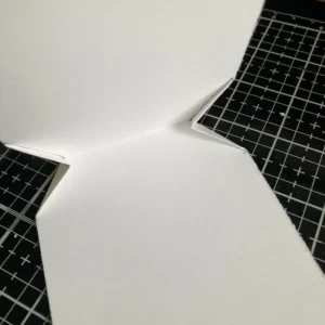 Inside of the folded tea bag card The inside of the tea bag-shaped card base, with folded triangles that create an interactive and functional feature for holding the tea bag.