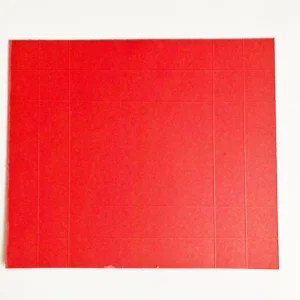 Scored Red Paper Card Stock Red cardstock with scored lines, ready to be assembled for the valentine treat box.