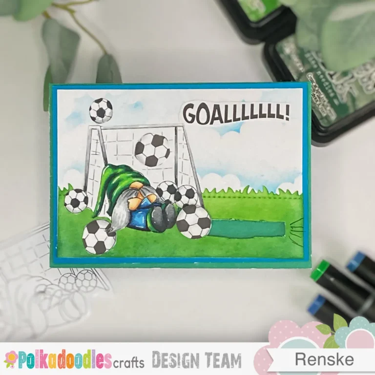 A top-down view of the handmade football birthday card lying straight. The football has moved to the end of the slider, positioned inside the goal. The gnome remains sitting against the goalpost, and the action line effect gives the illusion of movement. The sentiment "Goallllll!" in bold letters adds to the football theme.