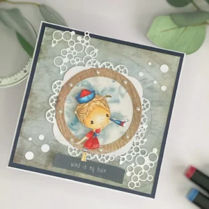 Nautical greeting card with little Sailor digital stamp All Dressed Up Stamps (2) Angled top-down shot of the nautical greeting card showing the depth and dimension created with layered die-cuts, foam tape, and the vibrant colouring of the little sailor girl.