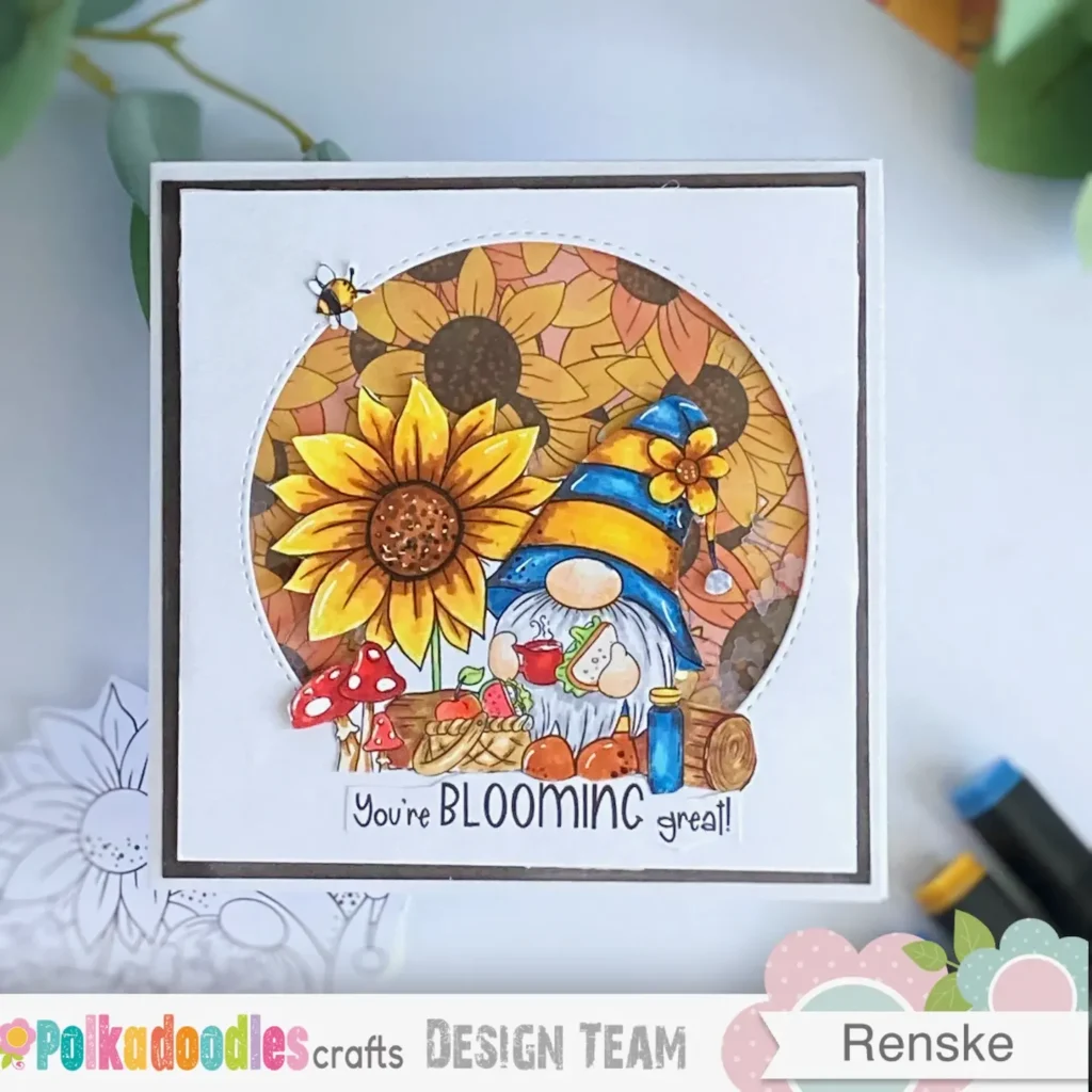 Top-down view of a completed gnome card with a sunflower shaker window, bright colours, and layered digital elements – part of a gnome card idea tutorial.