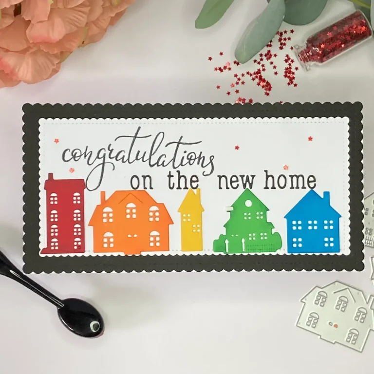 Top view of a handmade slimline new home card. Bright rainbow houses and layered panels show the finished design, perfect for how to make a new home card.