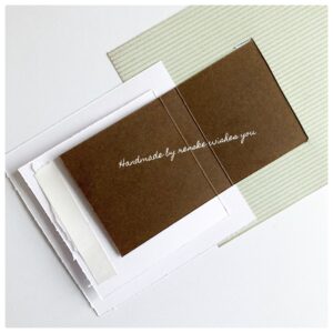 Back of the squares on the flip flap piece Picture of the back of the squares with double sided tape to show how to attach them.