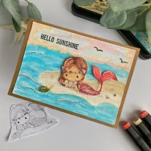 handmade mermaid card All Dressed up stamps Angled top-down view of a mermaid card, highlighting the three-dimensional elements like the foam-mounted mermaid, tiny turtle, shells, and summer embellishments for a dynamic perspective.