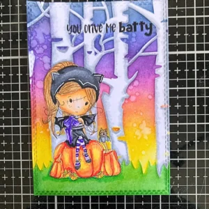 Fully colored digital stamp with inked background and trees — final scene reveal in how to make a Halloween card step-by-step tutorial.
