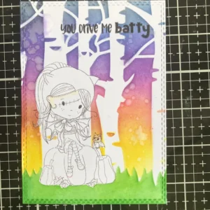 Finished Halloween background made with Distress Inks after removing masks. There is the green gras and yello, orange, pink, purple sky. 