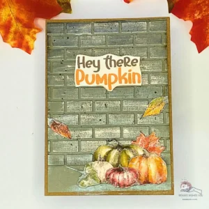 Urban brick wall pumpkin card “Completed handmade autumn card with embossed brick wall background and warm orange-red details.