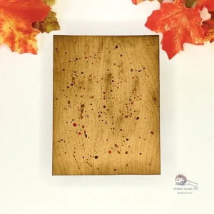 Woodgrain texture autumn background Close-up of a handmade woodgrain card background with embossed wood texture in rich brown and amber tones.