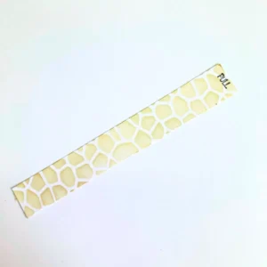 : A cardstock slider strip featuring a stone pattern and a stamped pull instruction for a handmade slider card.