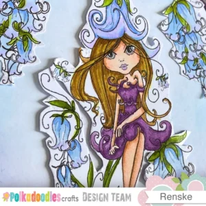 This close up highlights the alcohol marker colouring on the girl character.. Her hair has soft yellow and brown tones that stand out gently against the blue and purple flowers. And the purple dresss highlights the girl. The smooth blending creates a peaceful and dreamy appearance for this digital stamp card tutorial.