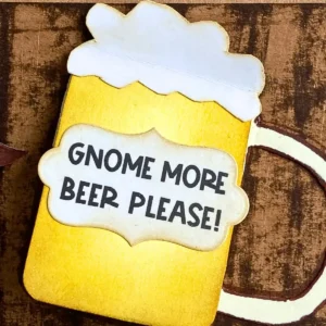 Close up of the beer pull flap with sentiment A close up of the beer mug flap featuring a foam top and a stamped sentiment banner. The wording adds a playful touch to the pub theme of our handmade Father’s Day card.