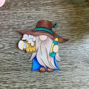 Finished coloured gnome The final coloured gnome is fussy cut with sharp scissors to leave a neat white border . This focal image is now ready to be placed on our flap card tutorial. The character brings a playful and lighthearted mood to the masculine design.